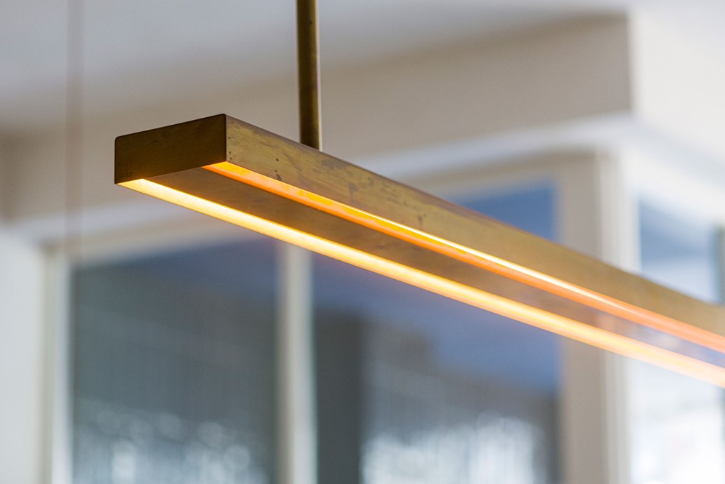 Long pendant strip light with gold finish