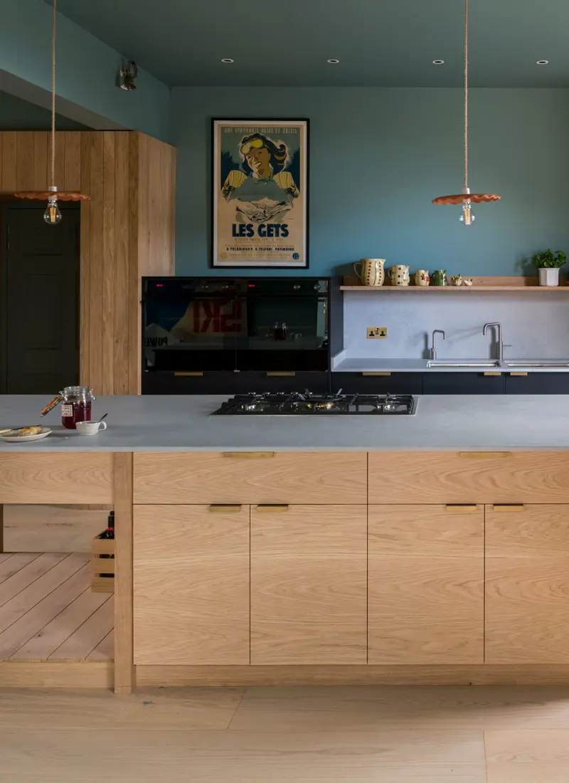 A thoughtfully handcrafted kitchen, blending natural materials with meticulous design, bathed in soft, inviting light.