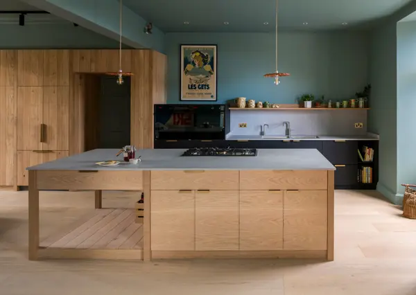 A thoughtfully handcrafted kitchen, blending natural materials with meticulous design, bathed in soft, inviting light.