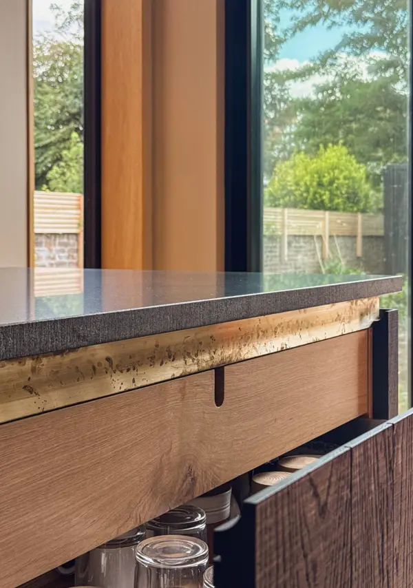 Kitchen details: oak drawers with patinated brass