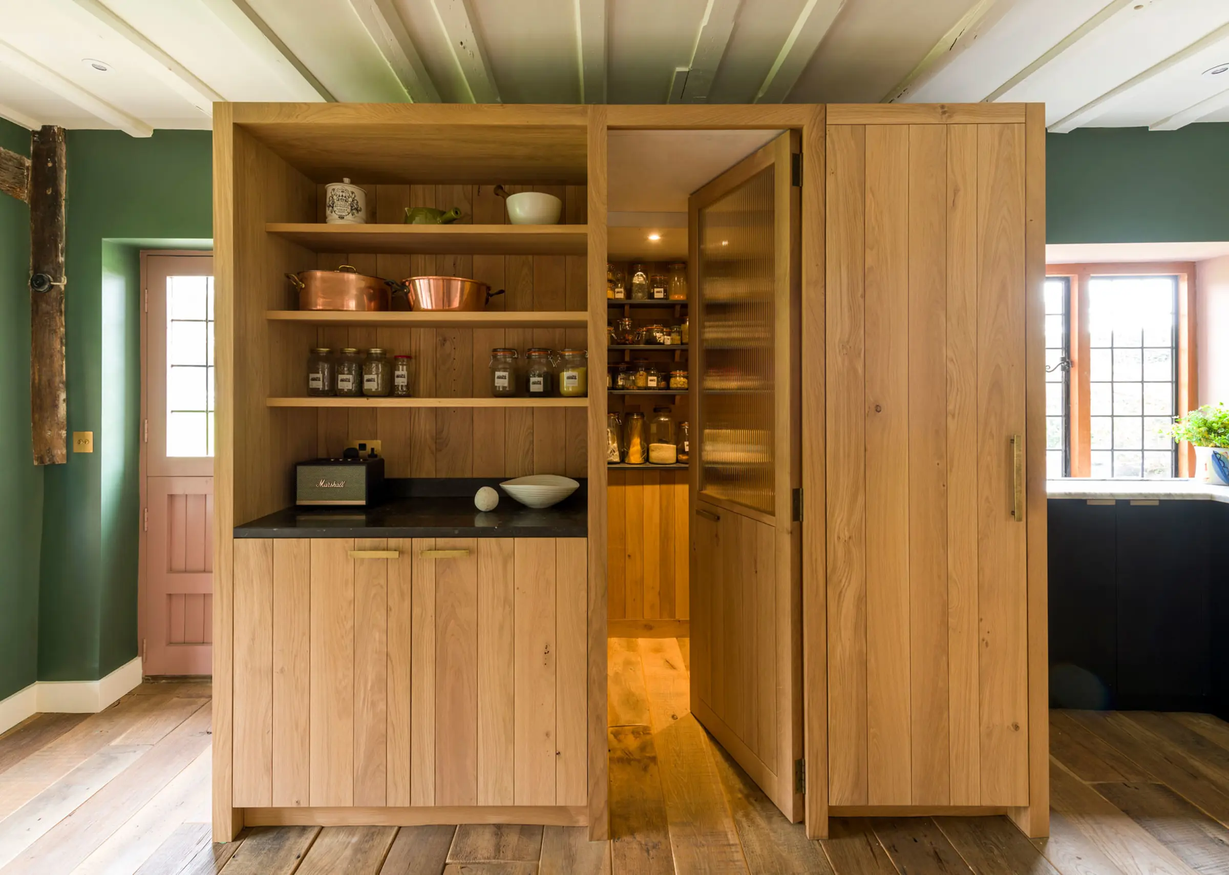 Transformative design creates a unique walk in pantry space of unparalleled elegance within an inglenook chimney. Considered design for modern living.