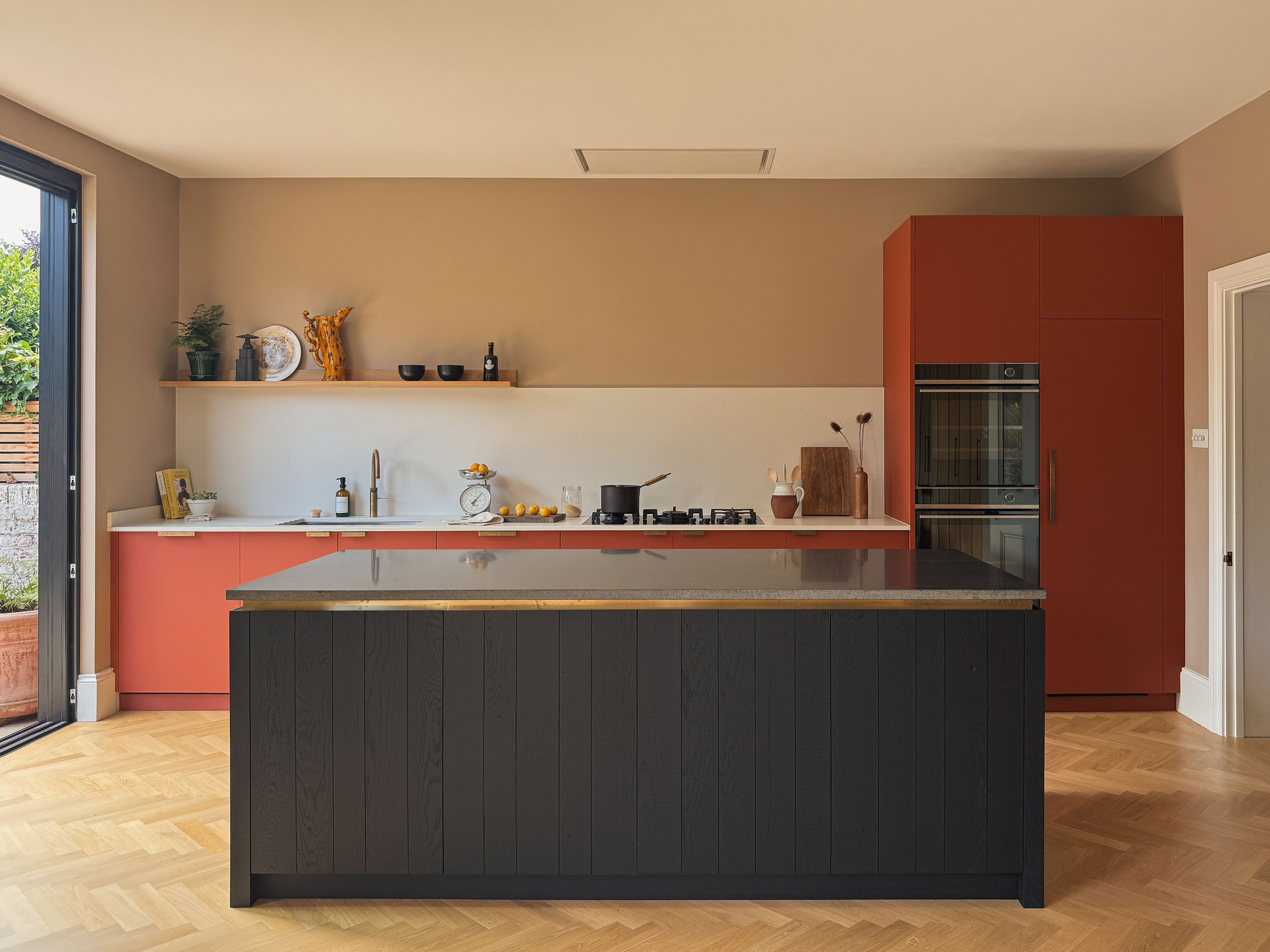 A contemporary Fenix and Oak Kitchen in Hove